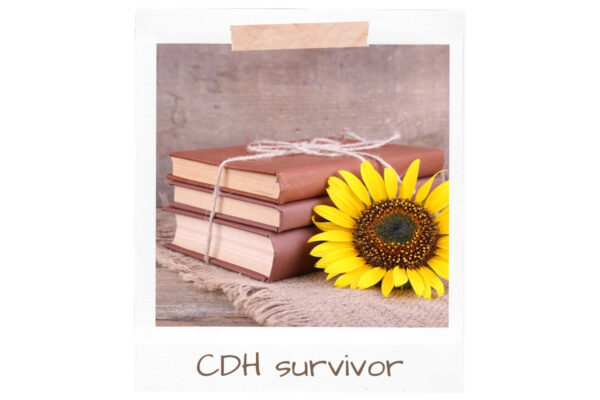 Books with sunflower representing CDH survivor stories