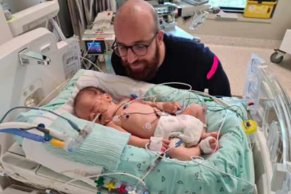 Father and baby in hospital